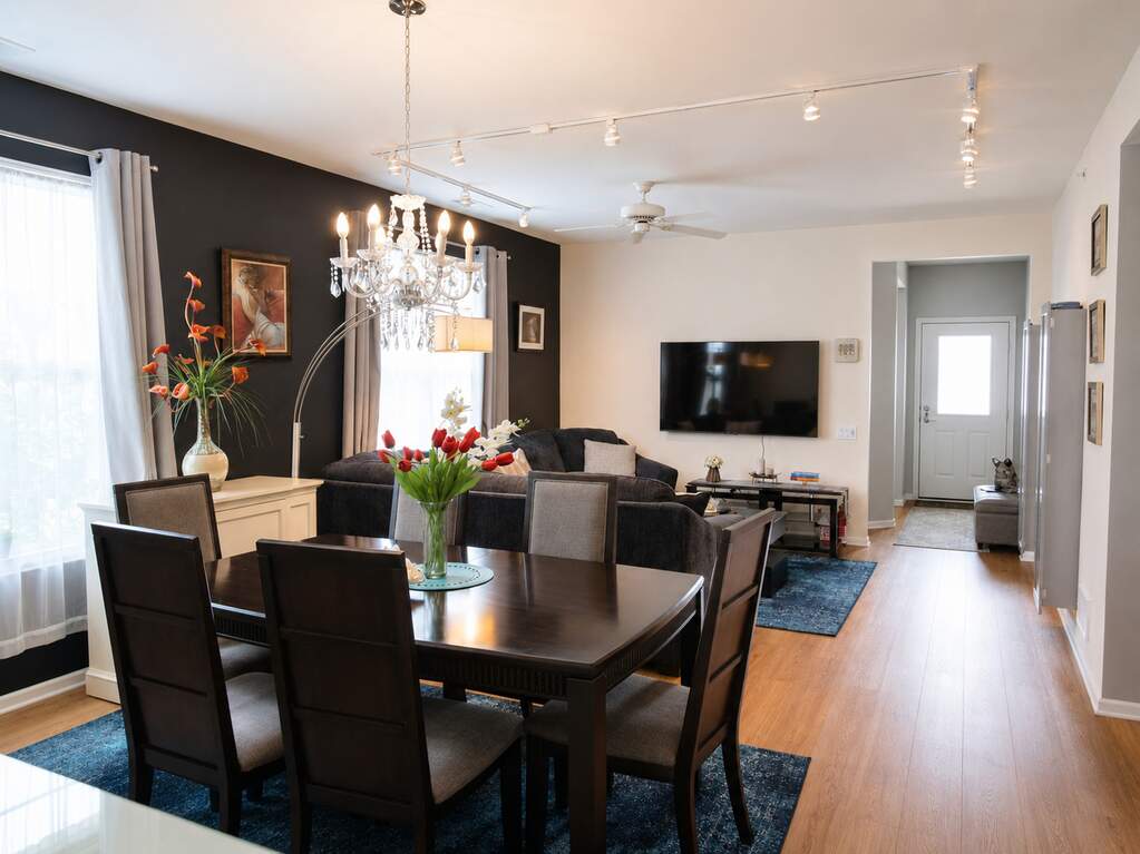 Open living and dining area with hardwood-look flooring