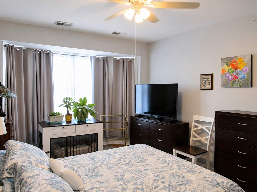 Main-level primary bedroom with bay window